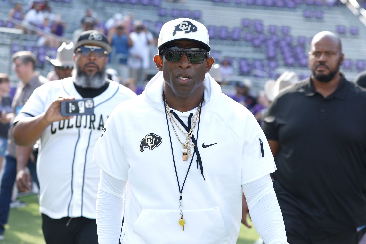 Colorado Buffaloes head coach Deon Sanders walks on the field before the game against the TCU Horned Frogs at Amon G. Carter Stadium